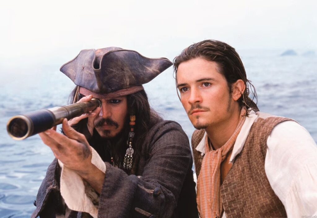 Johnny Depp e Orlando Bloom in una scena de I Pirati dei Caraibi, una delle saghe cinematografiche più amate